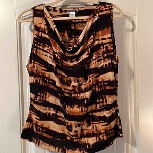 Sleeveless top with drape in the front. Beautiful colors with brown/tan/black